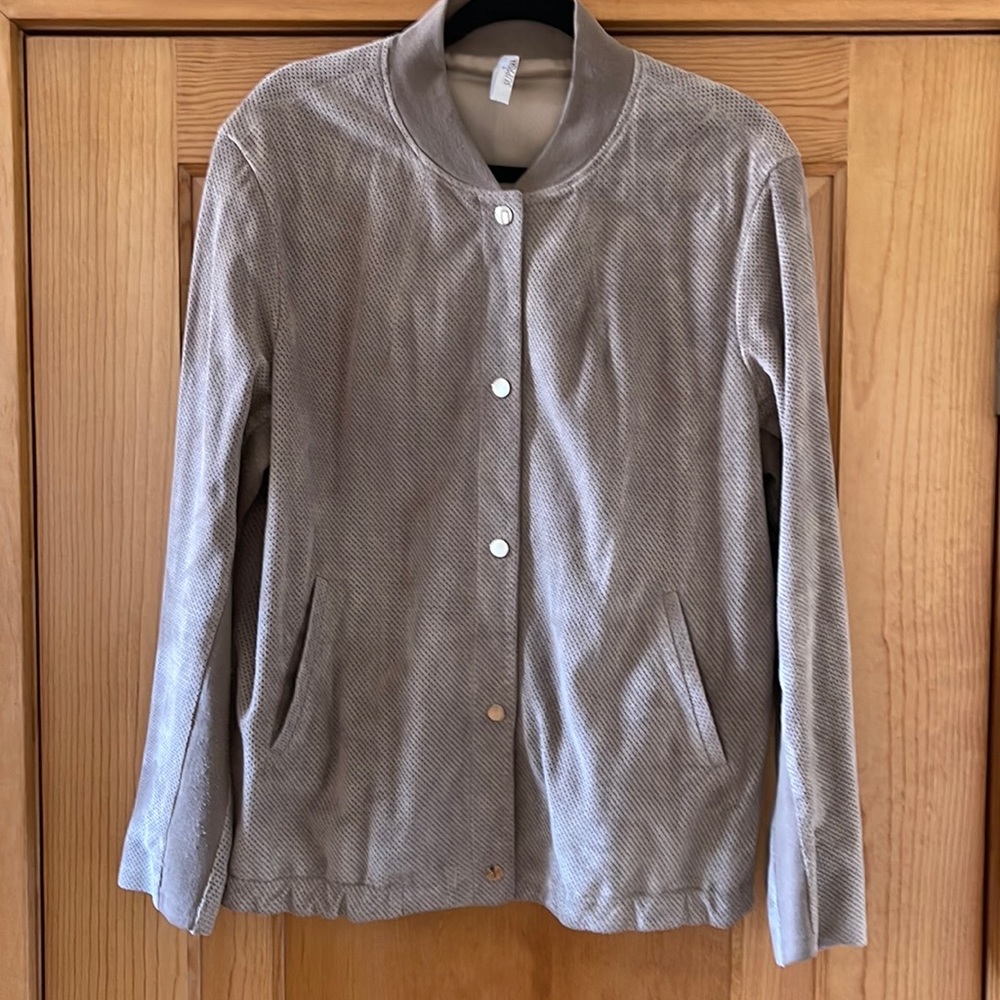SUPREMA perforated suede bomber jacket.